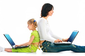 Woman and child with laptop