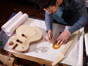 Man making a guitar