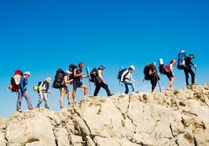 Hiking group trekking on a Crimean mountain.