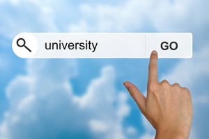 Stock photo of a hand about to click Go when searching with the term University.