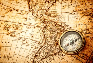 Photograph of vintage map and compass.